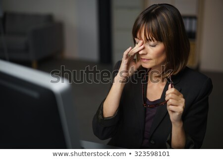 Stock photo: Young Woman Rubbing Her Head