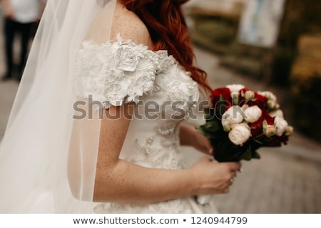 ストックフォト: Beautiful Redhead Bride With A Bouquet Of Flowers