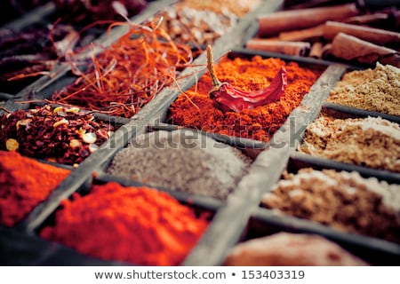 Stock photo: Assortment Of Different Colorful Powder Seasoning Close Up In Paper Corners On White Wooden Board Wi