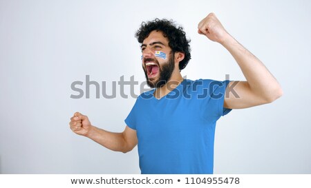 Сток-фото: Man With Flag Of Uruguay In A Crowd