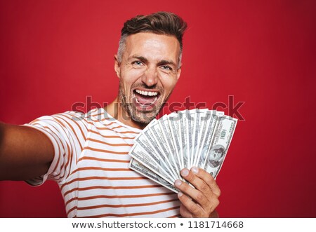 Foto stock: Photo Of Delighted Man In Striped T Shirt Smiling And Taking Sel