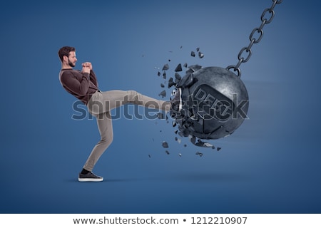 Stockfoto: Businessman Gets A Hit From A Giant Hand