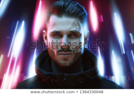 Zdjęcia stock: Young Man On Dark Background Face Recognition Concept