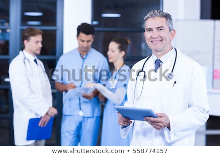 Сток-фото: Smiling Indian Male Doctor With Tablet Computer