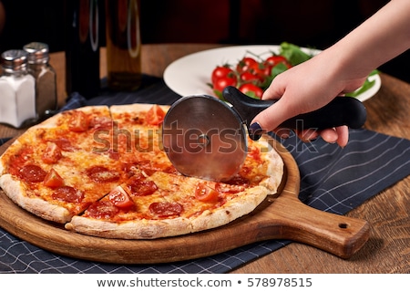 Stok fotoğraf: Fresh Round Baked Pepperoni Italian Pizza With Knife With Tomatoes And Basil On Light Background Wit