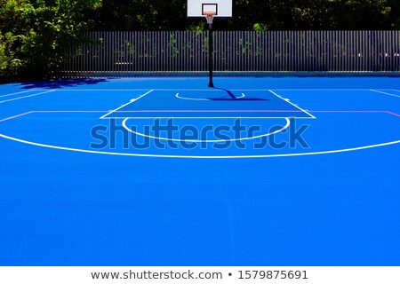 Stock fotó: Basketball Court In An Outdoor Park With Intense Midday Sun No