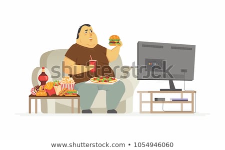 [[stock_photo]]: Couch Potato Eating And Watching Tv