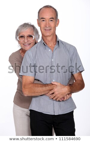 Stock fotó: Affectionate Senior Couple Stood In The Studio