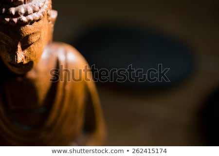 Stock photo: Wooden Buddha Statue On Table