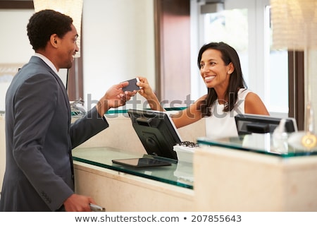 Zdjęcia stock: African American Woman Receptionist At Reception Desk Front View