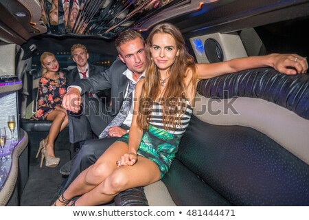 Stok fotoğraf: Celebrity Couple In A Limousine
