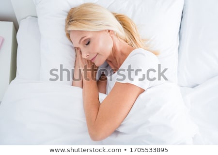 Stock foto: Young Pretty Blond Woman In Bed Covered White Sheets Smiling Che