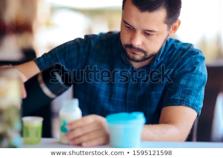 Stock photo: Father Making Baby Formula In Milk Bottle
