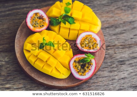 Foto stock: Mango And Passion Fruit On An Old Wooden Background