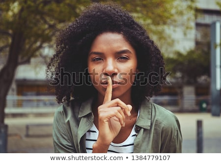 Stock photo: Beautiful Smiling Woman Making Hush Gesture