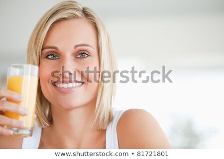 Foto stock: Blond Woman Eating Fruit Cocktail