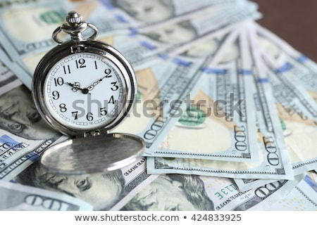 Foto stock: Pocket Watch And Dollars