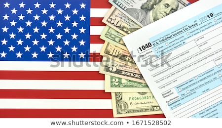 Stok fotoğraf: Tax Form And Money