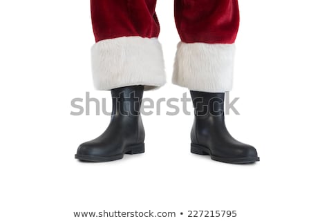 Foto stock: Father Christmas Boots And Legs