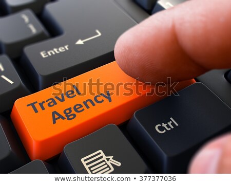 [[stock_photo]]: Finger Presses Orange Keyboard Button Travel Agency