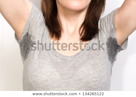 [[stock_photo]]: Woman Sweating Very Badly Under Armpit