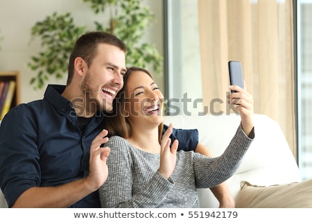 Сток-фото: Happy Couple Taking Selfie By Smartphone At Home