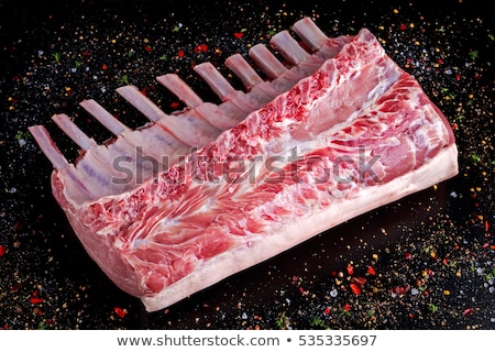 Stock fotó: Fresh Raw Pieces Of Pork Ribs On Chopping Board And Vintage Meat Hatchet Fork And Knife On Wooden B