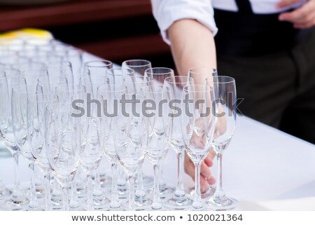 ストックフォト: Smiling Woman Cleaning Glassware Of Cafeteria