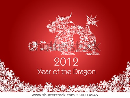 Foto d'archivio: 2012 Chinese Year Of The Dragon Snowflakes Red Background