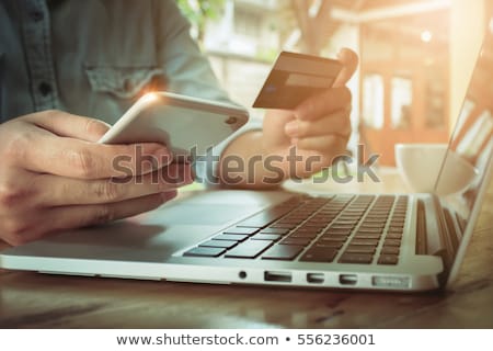 Stok fotoğraf: Credit Card Online Transaction Using Smartphone