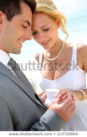 Stock fotó: Couple Smiling Exchanging Flowers