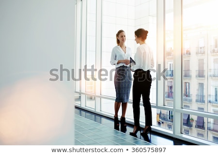 Сток-фото: Two Business Woman In A Hallway