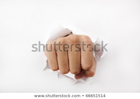 Foto d'archivio: Crack A Fist Punches The Paper