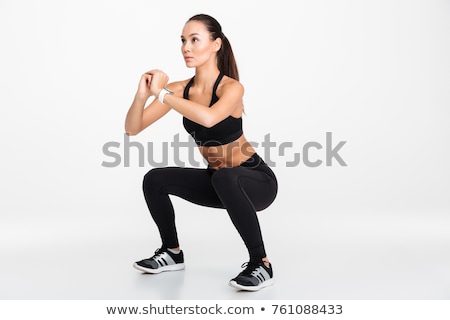 Stock fotó: Portrait Of A Confident Asian Fitness Woman Doing Squats