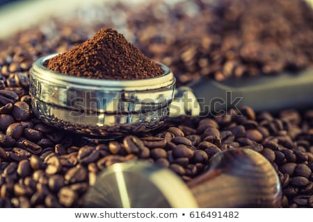 Stock photo: Italian Coffee Maker And Fresh Coffee Beans Coffee Beans In The Form Of A Drink Stream On A Gray Sto