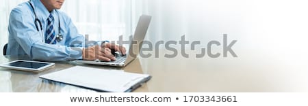 [[stock_photo]]: Doctor Using Computer