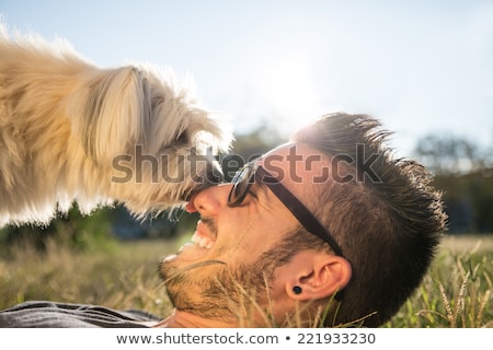 Zdjęcia stock: Boy Playing With His Dog Has Fun