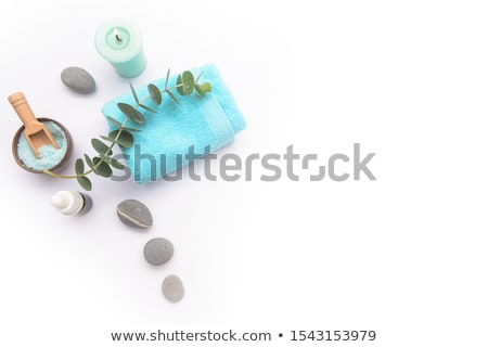Stok fotoğraf: Massage Oil Set With Palm Leaf Flowers Top View