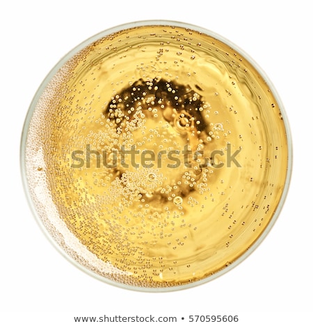 Foto stock: Yellow Champagne Glass With Bubbles Top View