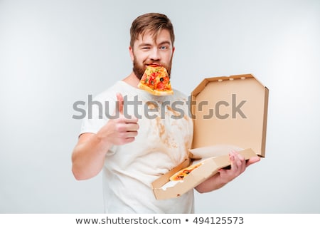 Stockfoto: A Man Eating Pizza On White Background