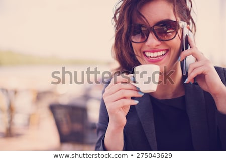 Stock fotó: Happy Young Women Drinking Coffee At Outdoor Cafe