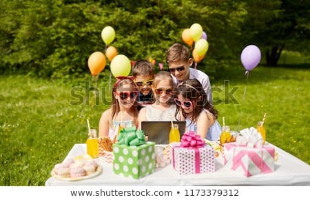 [[stock_photo]]: Happy Kids With Tablet Pc On Birthday Party