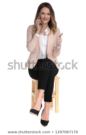 Stockfoto: Businesswoman Speaking On The Phone Makes Thumbs Up Sign