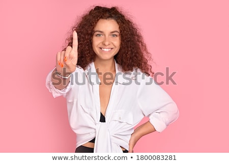 Foto stock: Pretty Young Woman Posing Isolated Over Pink Wall Background With Flowers