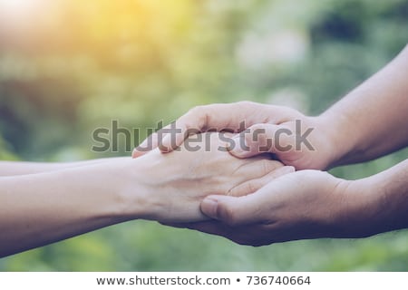 Zdjęcia stock: A Childs Hand Holding The Hand Of An Old Man