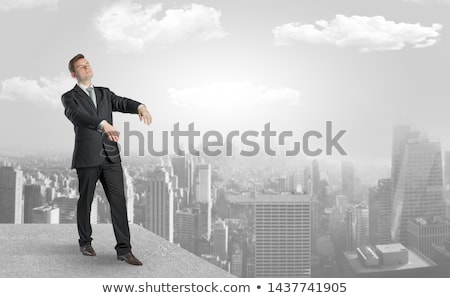 Foto stock: Sleepy Businessman On The Top Of The City