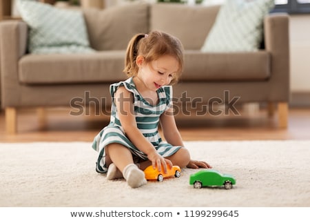 Stock foto: Little Girl With Toys