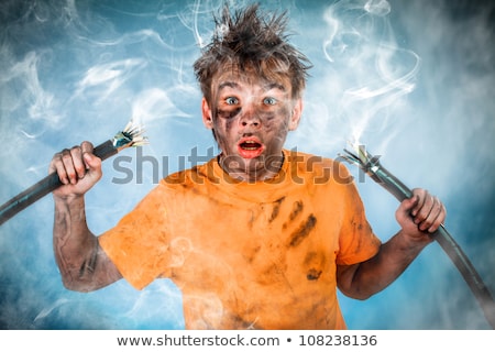 Stok fotoğraf: Electrician Having An Electric Shock