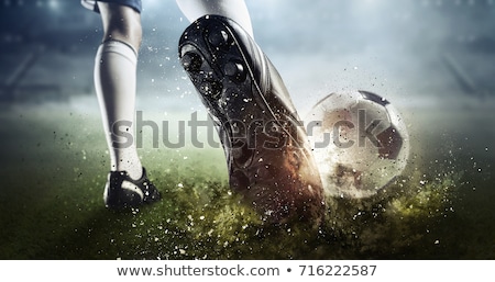 Stok fotoğraf: Boy Kicking Soccer Ball