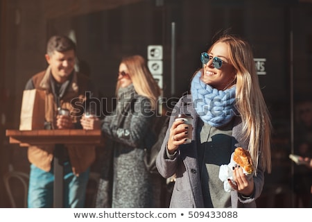 Stock fotó: Happy Woman Holding A Cup Of Coffee And Croissant